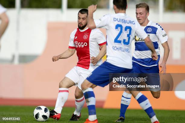 Amin Younes of Ajax, Lukas Daschner of MSV Duisburg during the match between Ajax v MSV Duisburg at the Estadio Municipal on January 13, 2018 in...