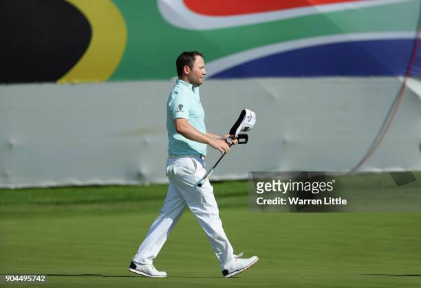 Branden Grace of South Africa acknowledges the crowd on thw 18th green during the third round of the BMW South African Open Championship at Glendower...