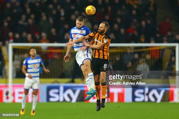 David Meyler of Hull City battles for control of the ball with Joey van den Berg of Reading during the Sky Bet Championship match between Hull City...