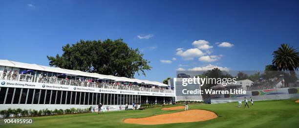 Branden Grace of South Africa putts on the 18th green dduring the third round of the BMW South African Open Championship at Glendower Golf Club on...