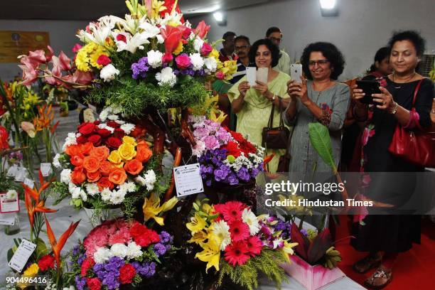 Visitors visit during the flower exhibition at Raymond ground, Vartak Nager, on January 12, 2018 in Mumbai, India.