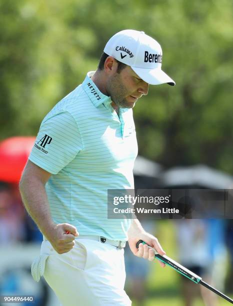 Branden Grace of South Africa celebrates a bridie on the 17th green during the third round of the BMW South African Open Championship at Glendower...