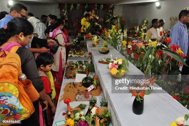 Visitors visit during the flower exhibition at Raymond ground, Vartak Nager, on January 12, 2018 in Mumbai, India.