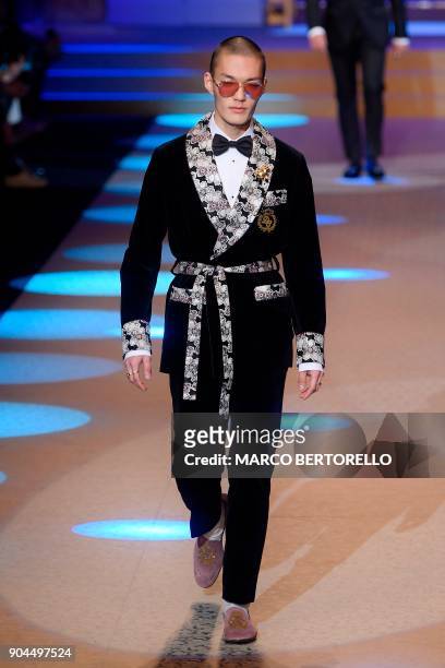 Model presents a creation for fashion house Dolce & Gabbana during the Men's Fall/Winter 2019 fashion shows in Milan, on January 13, 2018. / AFP...