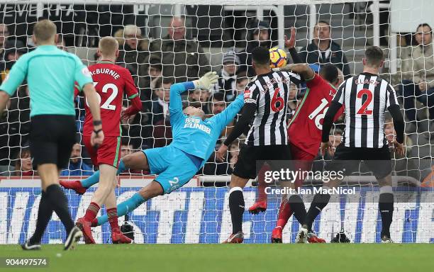 Jordan Ayew of Swansea City scores the opening goal during the Premier League match between Newcastle United and Swansea City at St. James Park on...