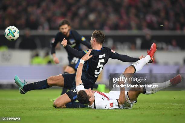 Mario Gomez of Stuttgart fights for the ball with Niklas Stark of Berlin who then scores an own goal to make it 1:0 during the Bundesliga match...