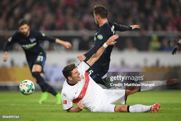 Mario Gomez of Stuttgart fights for the ball with Niklas Stark of Berlin who then scores an own goal to make it 1:0 during the Bundesliga match...