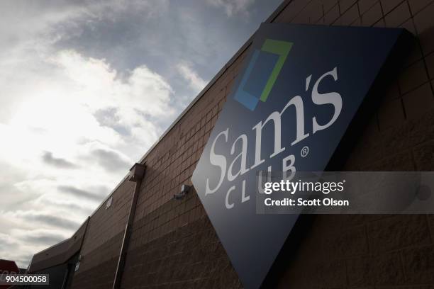 Sign hangs outside a Sam's Club store on January 12, 2018 in Streamwood, Illinois. The store is one of more 60 sheduled to close nationwide by the...