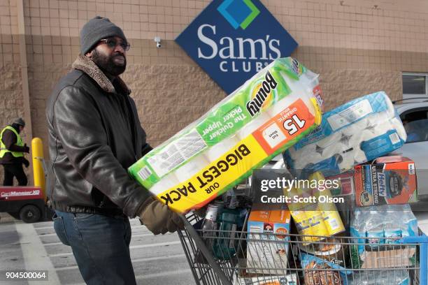 Shopper stocks up on merchandise at a Sam's Club store on January 12, 2018 in Streamwood, Illinois. The store is one of more 60 sheduled to close...