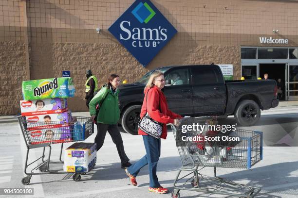Shoppers stock up on merchandise at a Sam's Club store on January 12, 2018 in Streamwood, Illinois. The store is one of more 60 sheduled to close...