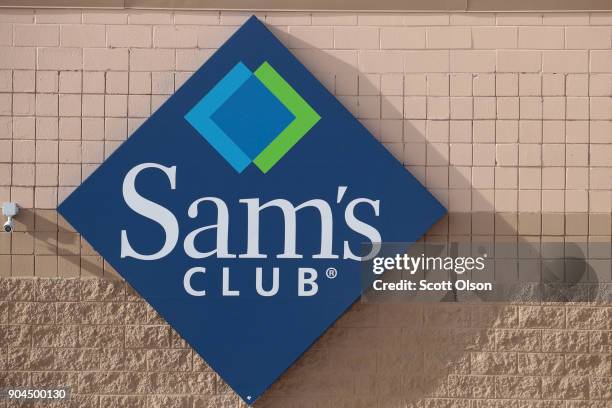 Sign hangs outside a Sam's Club store on January 12, 2018 in Streamwood, Illinois. The store is one of more 60 sheduled to close nationwide by the...