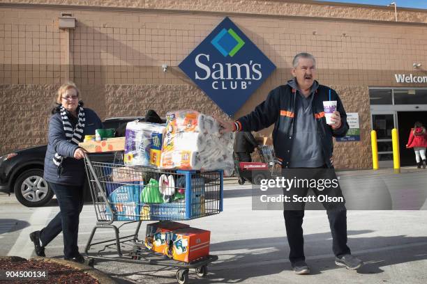 Shoppers stock up on merchandise at a Sam's Club store on January 12, 2018 in Streamwood, Illinois. The store is one of more 60 sheduled to close...