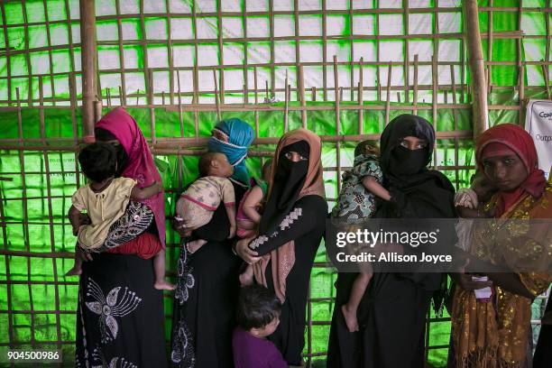 Rohingya refugees are seen at a malnutrition center in Balukhali camp on January 13, 2018 in Cox's Bazar, Bangladesh. Over 650,000 Rohingya have...