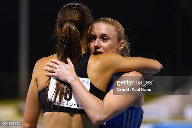 Sally Pearson is embraxced by Brianna Beahan after winning the women's 100 metre hurdles during the Jandakot Airport Perth Track Classic at WA...