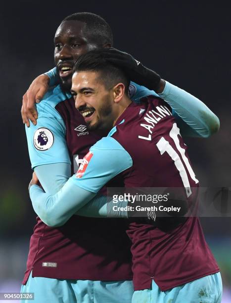 Manuel Lanzini of West Ham United celebrates with teammate Cheikhou Kouyate after scoring his sides fourth goal during the Premier League match...