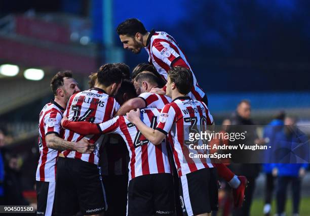 Lincoln City's Matt Green celebrates scoring his sides second goal with team mates during the Sky Bet League Two match between Lincoln City and Notts...