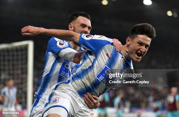 Joe Lolley of Huddersfield Town celebrates after scoring his sides first goal during the Premier League match between Huddersfield Town and West Ham...