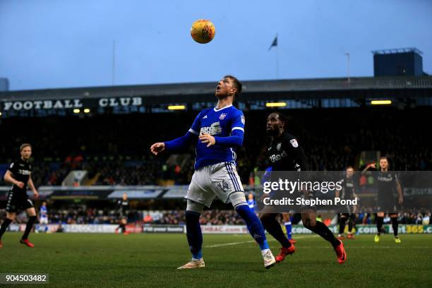 Vurnon Anita of Leeds United and Joe Garner of Ipswich Town compete for the ball during the Sky Bet Championship match between Ipswich Town and Leeds...