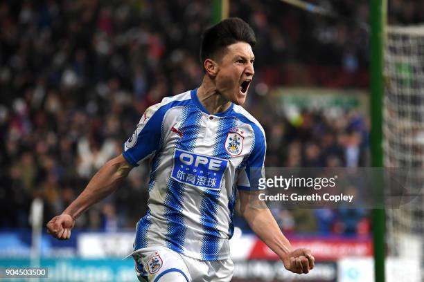 Joe Lolley of Huddersfield Town celebrates after scoring his sides first goal during the Premier League match between Huddersfield Town and West Ham...