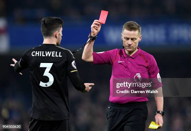 Ben Chilwell of Leicester City is shown a red card by referee Mike Jones during the Premier League match between Chelsea and Leicester City at...