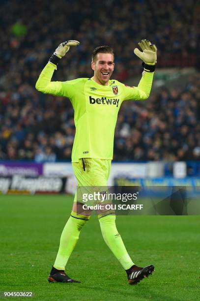 West Ham United's Spanish goalkeeper Adrian celebrates after West Ham United's Argentinian midfielder Manuel Lanzini scored their fourth goal during...