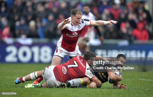 Craig Gilroy and Sean Reidy of Ulster and Geoffrey Doumayrou of La Rochelle during the European Rugby Champions Cup match between Ulster Rugby and La...