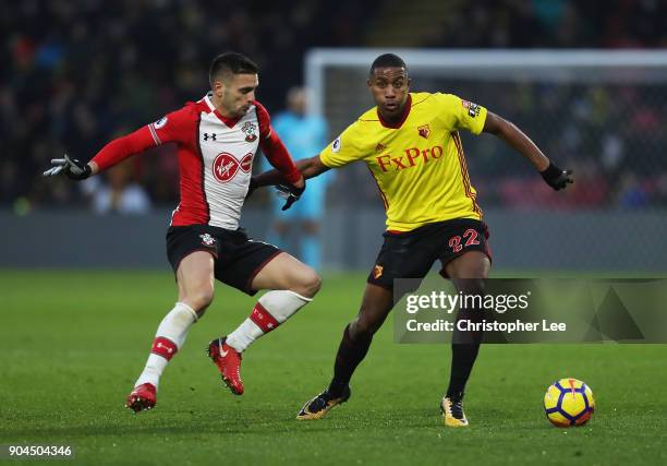 Marvin Zeegelaar of Watford is challenged by Dusan Tadic of Southampton during the Premier League match between Watford and Southampton at Vicarage...