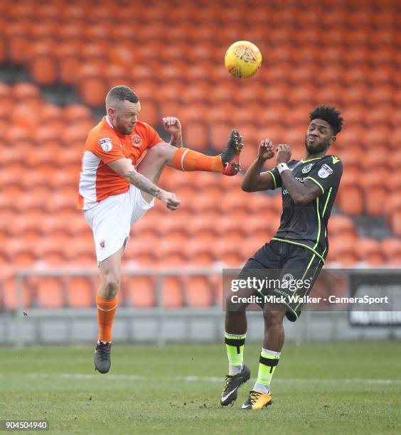 Blackpool's Jay Spearing battles with Bristol Rovers' Ellis Harrison during the Sky Bet League One match between Blackpool and Bristol Rovers at...