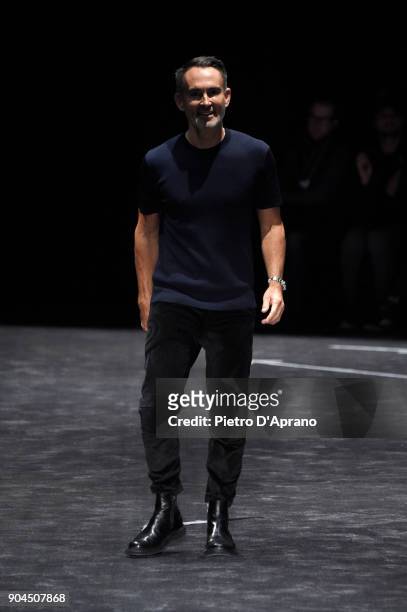 Fashion Designer Neil Barrett acknowledges the applause of the audience at his show during Milan Men's Fashion Week Fall/Winter 2018/19 on January...