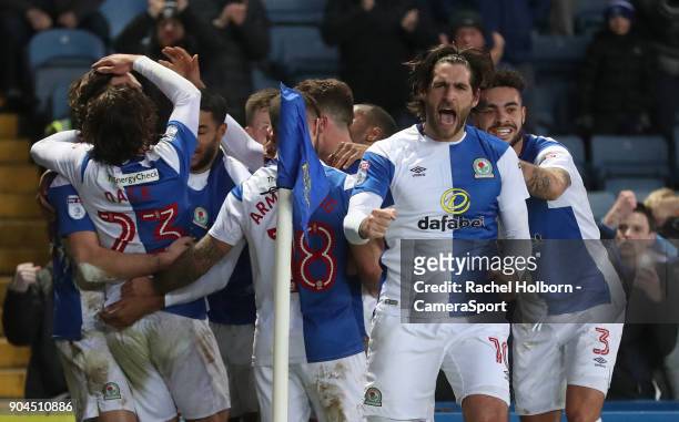 Blackburn Rovers' Charlie Mulgrew is swamped by teammates after scoring the third goal with Blackburn Rovers' Danny Graham leading the...