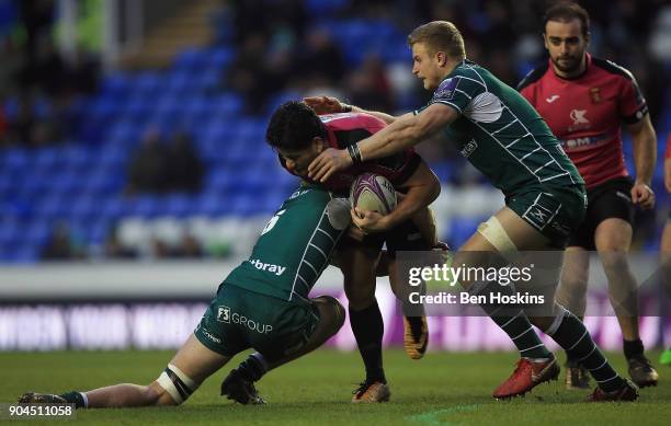 Fangatapu Apikotoa of Krasny Yar is tackled by Jack Cooke of London Irish during the European Rugby Challenge Cup between London Irish and Krasny Yar...