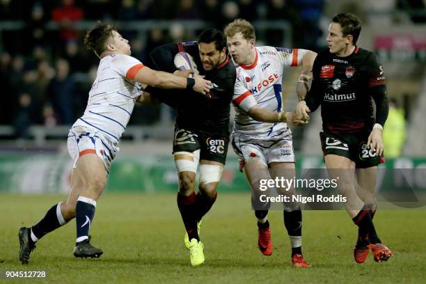 Rohan Janse Van Rensburg of Sale Sharks tackles Rudi Wulf of Lyon during the European Rugby Challenge Cup match between Sale Sharks and Lyon at the...