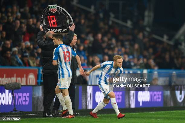 Huddersfield Town's English midfielder Alex Pritchard comes on for Huddersfield Town's English midfielder Joe Lolley during the English Premier...