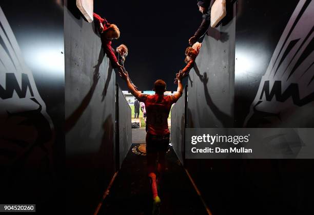 Henry Slade of Exeter Chiefs high fives young supporters following during the European Rugby Champions Cup match between Exeter Chiefs and...