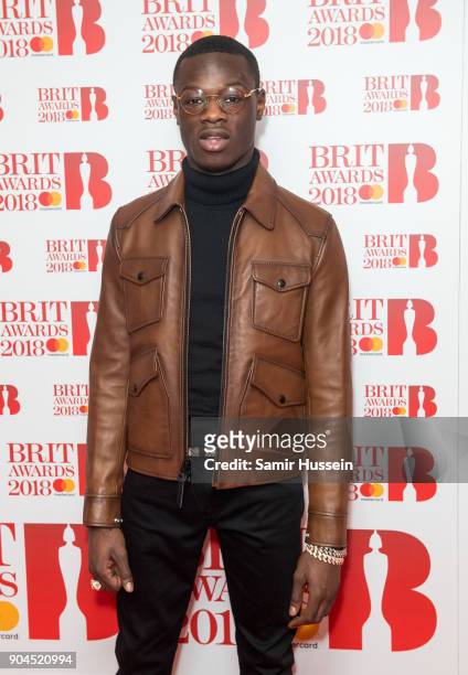 Images from this event are only to be used in relation to this event. J Hus attends The BRIT Awards 2018 nominations photocall held at ITV Studios on...
