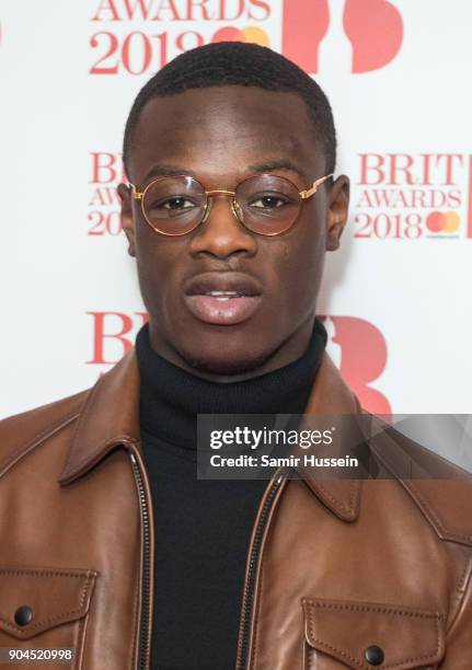 Images from this event are only to be used in relation to this event. J Hus attends The BRIT Awards 2018 nominations photocall held at ITV Studios on...