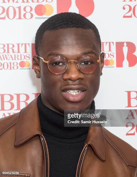 Images from this event are only to be used in relation to this event. J Hus attends The BRIT Awards 2018 nominations photocall held at ITV Studios on...
