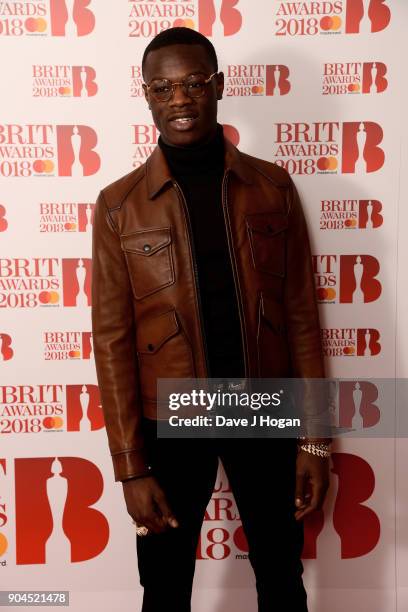 Images from this event are only to be used in relation to this event. J Hus attends The BRIT Awards 2018 nominations photocall held at ITV Studios on...