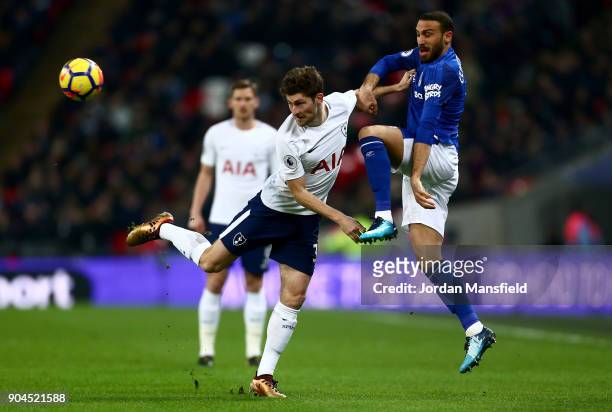 Ben Davies of Tottenham Hotspur is challenged by Cenk Tosun of Everton during the Premier League match between Tottenham Hotspur and Everton at...