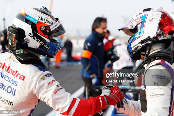 In this handout provided by FIA Formula E - Felix Rosenqvist , Mahindra Racing, Mahindra M4Electro, celebrates with Sam Bird , DS Virgin Racing, DS...