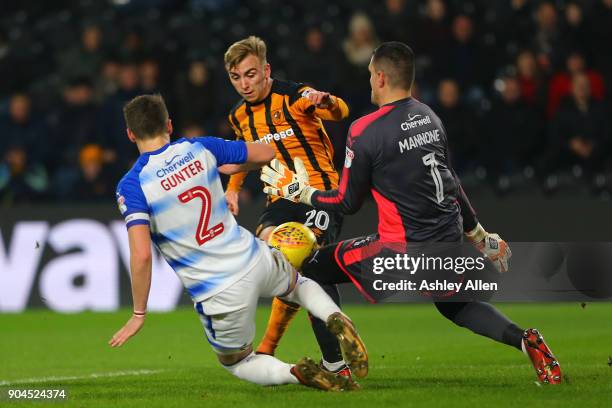 Jarrod Bowen of Hull City has a shot on goal blocked by both Chris Gunter and goalkeeper Vito Mannone of Reading during the Sky Bet Championship...
