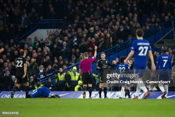 Leicester City's Ben Chilwell is shown a red card by Referee Michael Jones for a second yellow card offence during the Premier League match between...