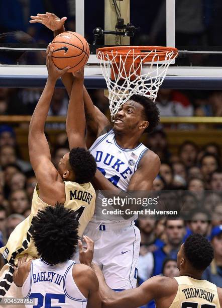 Wendell Carter Jr of the Duke Blue Devils blocks a shot by Doral Moore of the Wake Forest Demon Deacons during their game at Cameron Indoor Stadium...