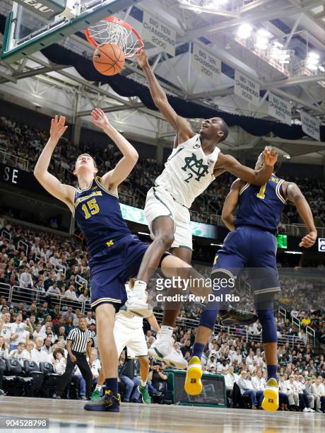 Jaren Jackson Jr. #2 of the Michigan State Spartans dunks the ball in the in the first half against the Michigan Wolverines at Breslin Center on...