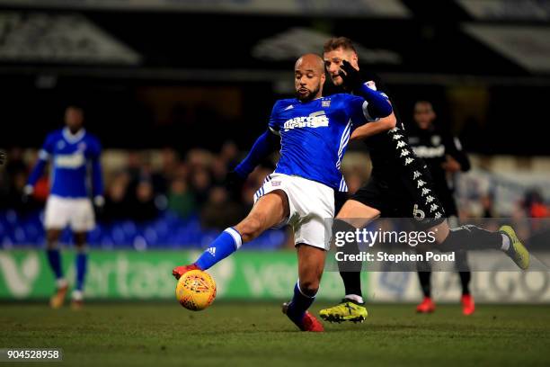 David McGoldrick of Ipswich Town controls the ball ahead of Liam Cooper of Leeds United during the Sky Bet Championship match between Ipswich Town...