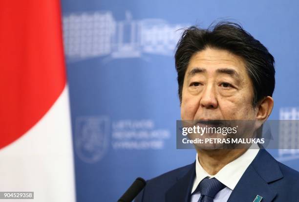 Japan's Prime Minister Shinzo Abe addresses a press conference with his Lithuanian counterpart after their meeting in Vilnius, Lithuania on January...