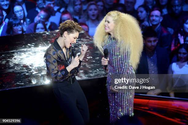 Images from this event are only to be used in relation to this event. Host Emma Willis and Paloma Faith speak on stage at The BRIT Awards 2018...