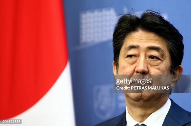 Japan's Prime Minister Shinzo Abe addresses a press conference with his Lithuanian counterpart after their meeting in Vilnius, Lithuania on January...