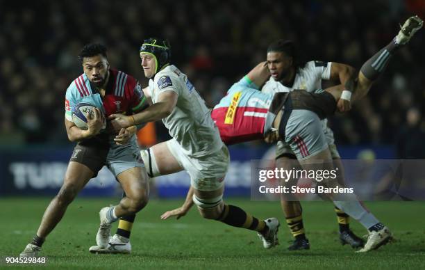 Alofa Alofa of Harlequins is tackled by James Gaskell of Wasps during the European Rugby Champions Cup match between Harlequins and Wasps at...