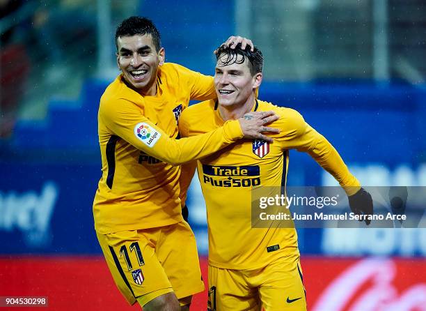 Kevin Gameiro of Atletico Madrid celebrates with his teammate Angel Correa of Atletico Madrid after scoring the opening goal during the La Liga match...